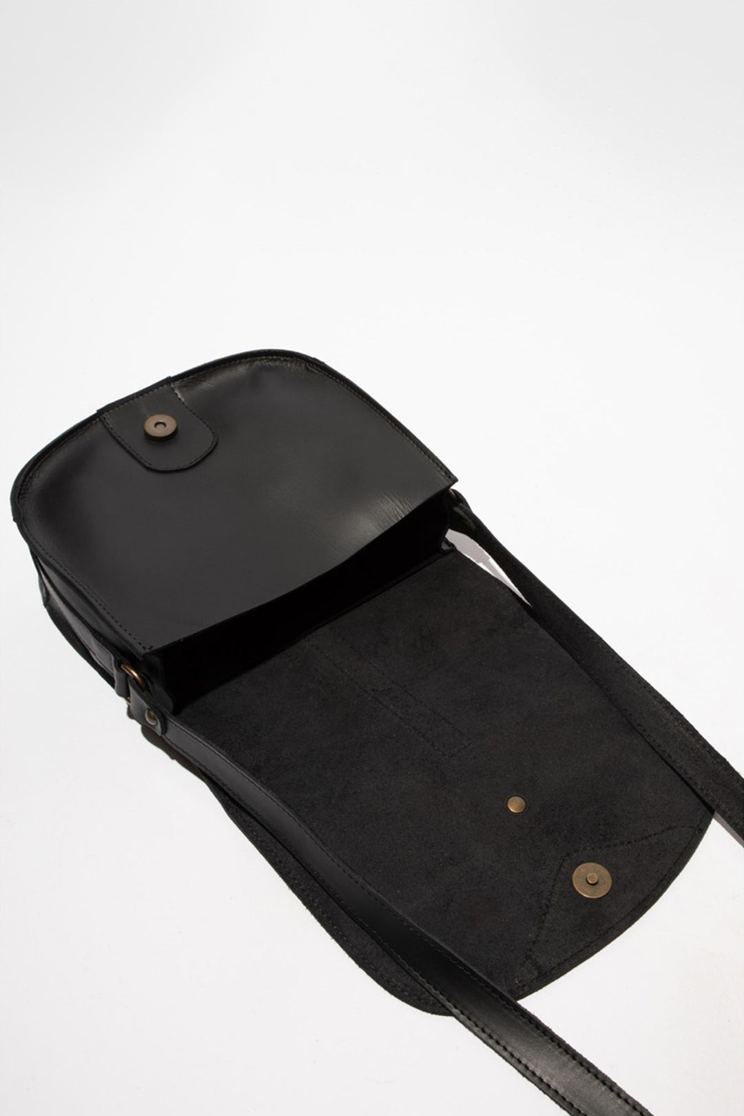 Black leather bag with a strap on a white background