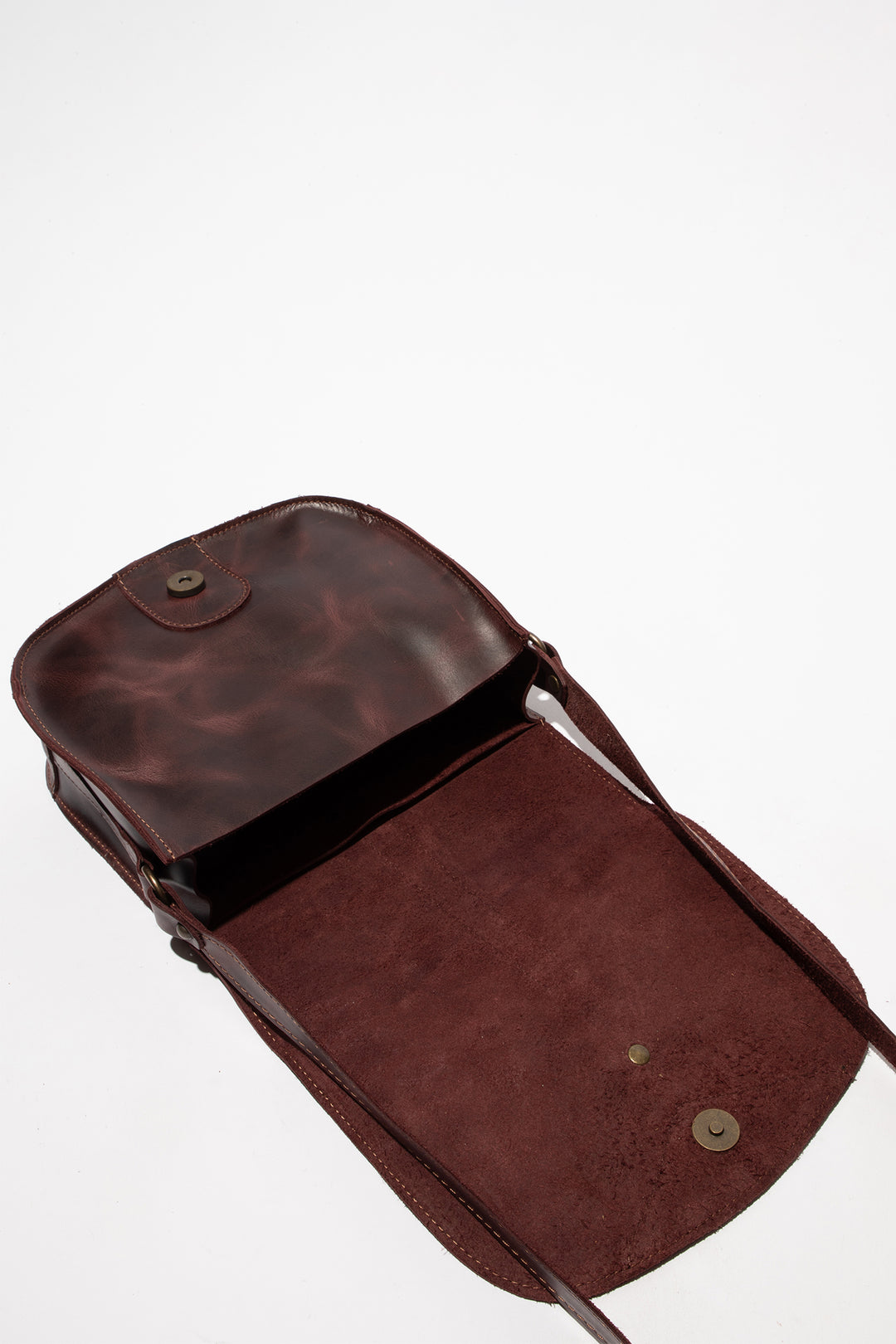 Brown leather bag on a white background