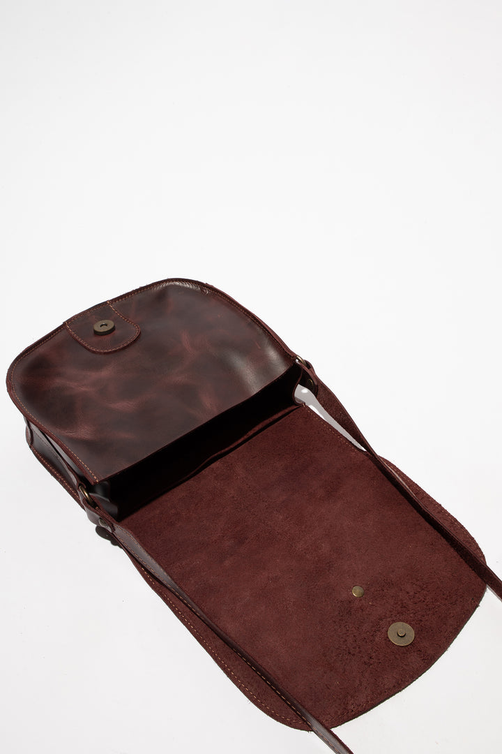 Brown leather bag on a white background