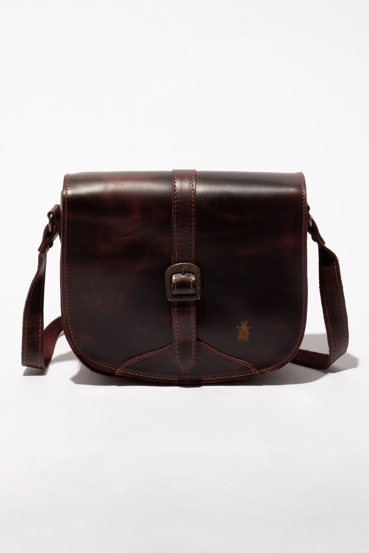 Brown leather bag with a visible brand logo on a white background