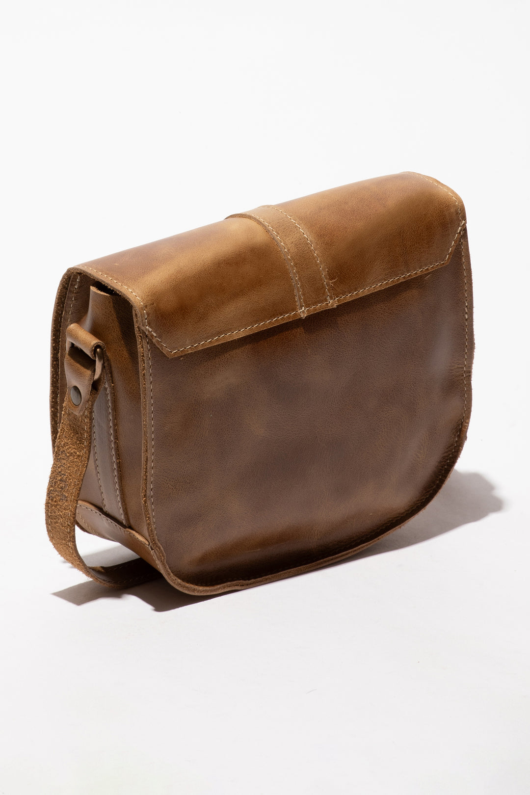 Brown leather satchel bag on a white background