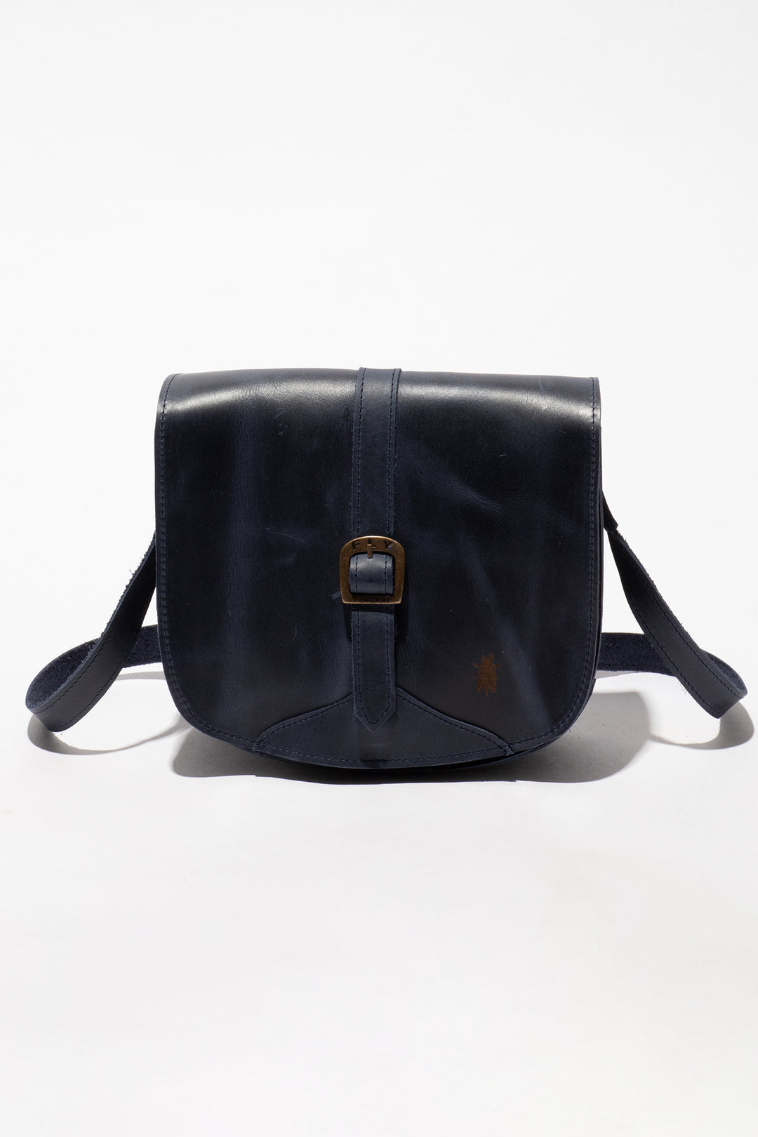 Navy leather bag with a buckle on a white background