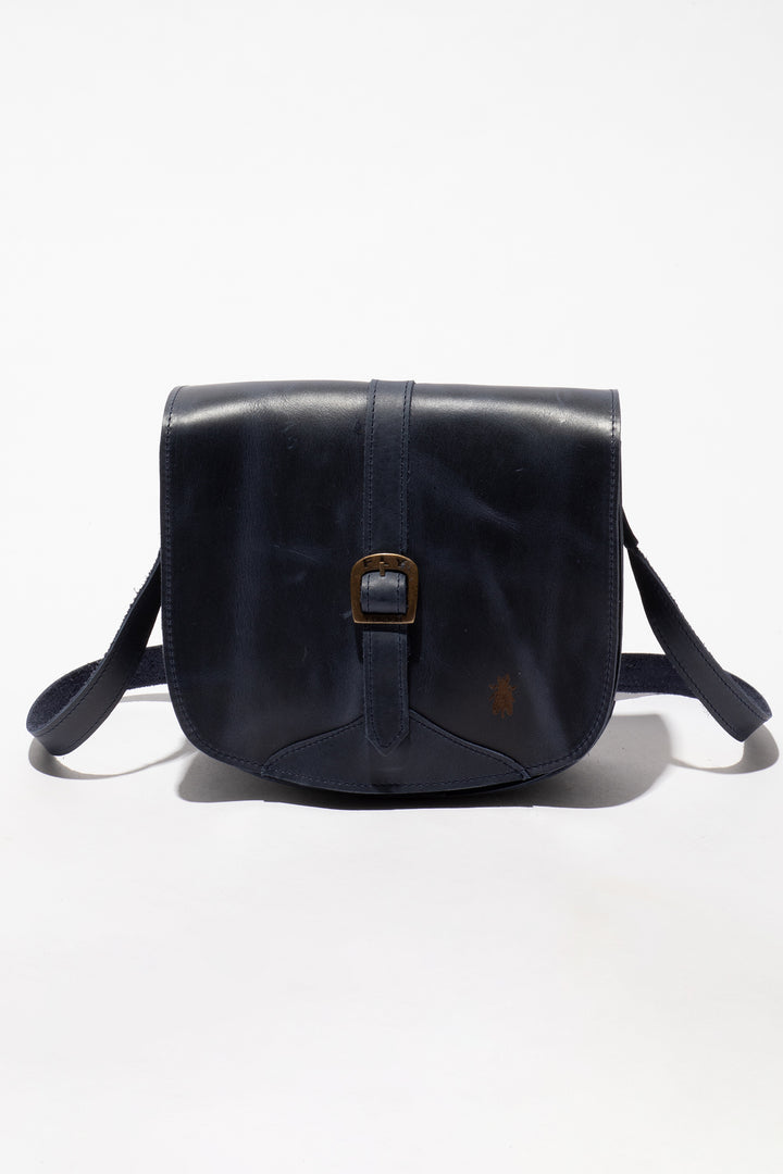 Navy leather bag with a buckle on a white background
