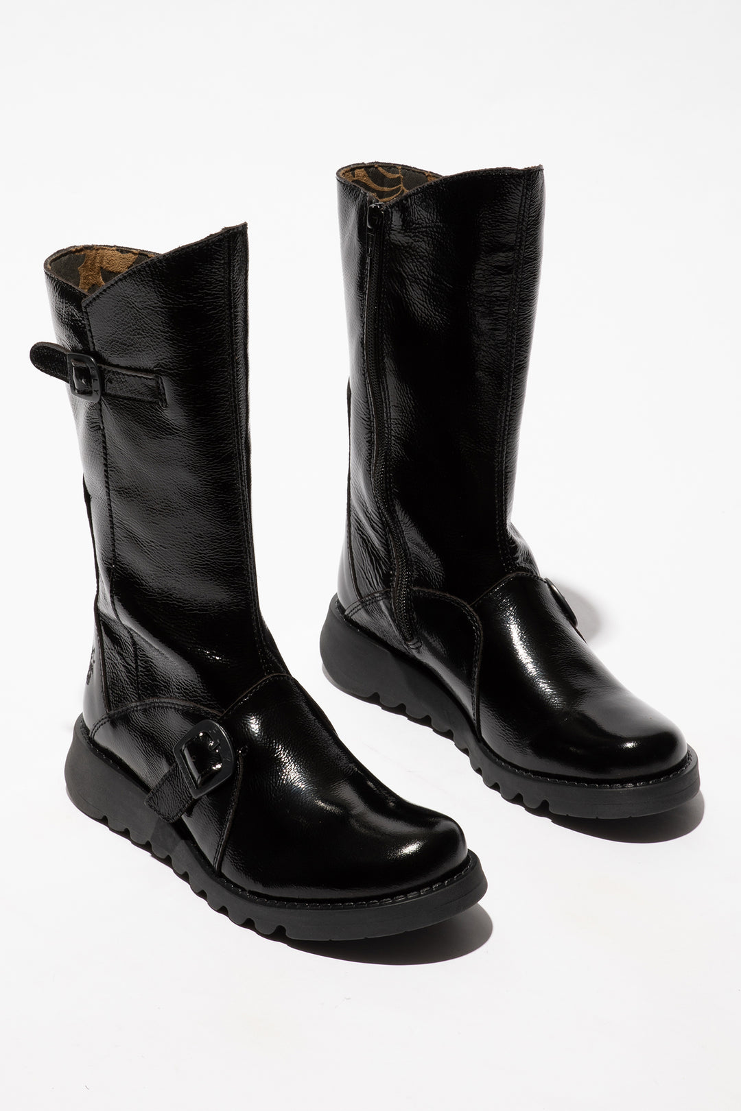 Pair of black leather boots on a white background