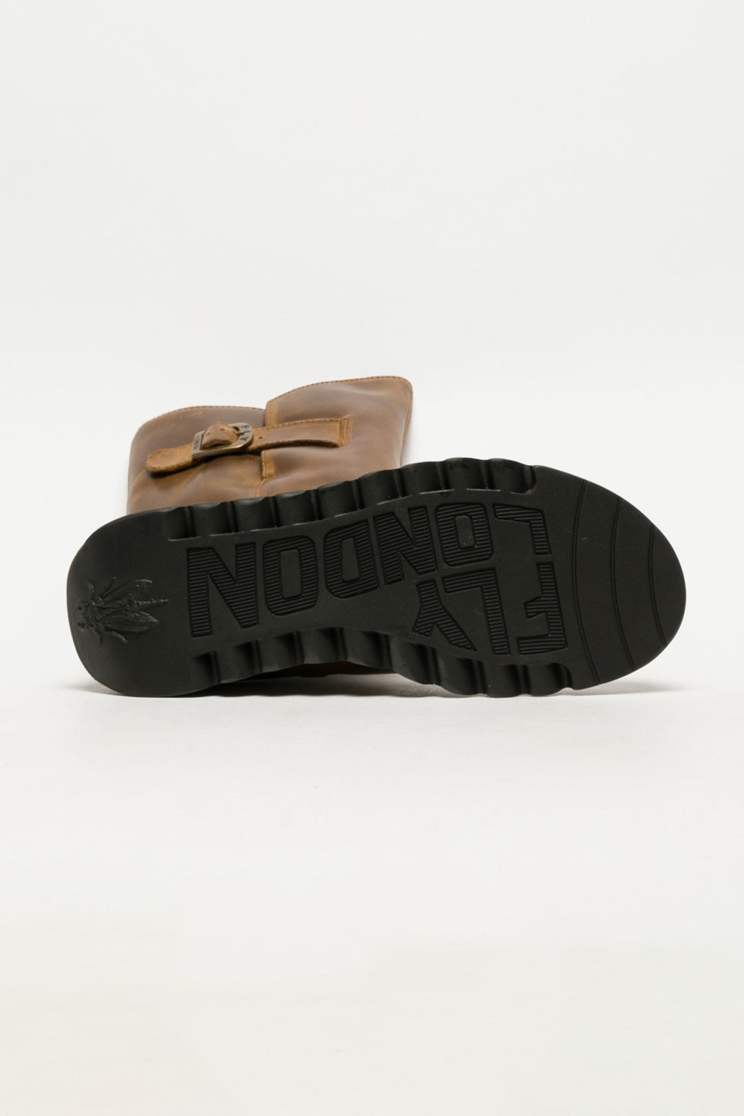 Brown sandal with black sole on a white background