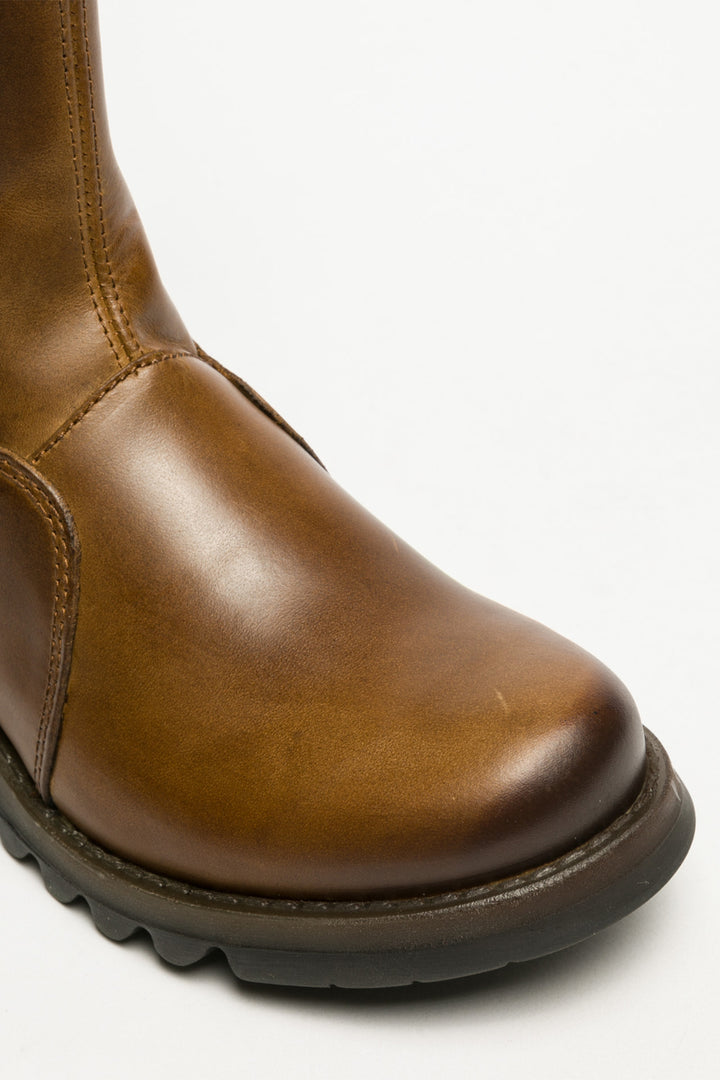 Brown leather boot on a white background