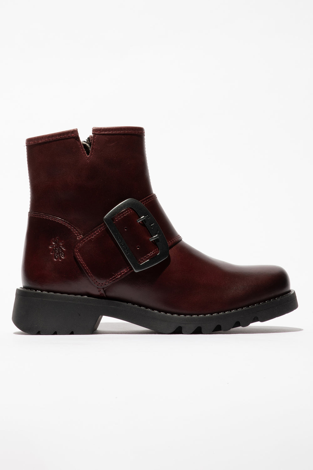 Brown ankle boot with a buckle on a white background