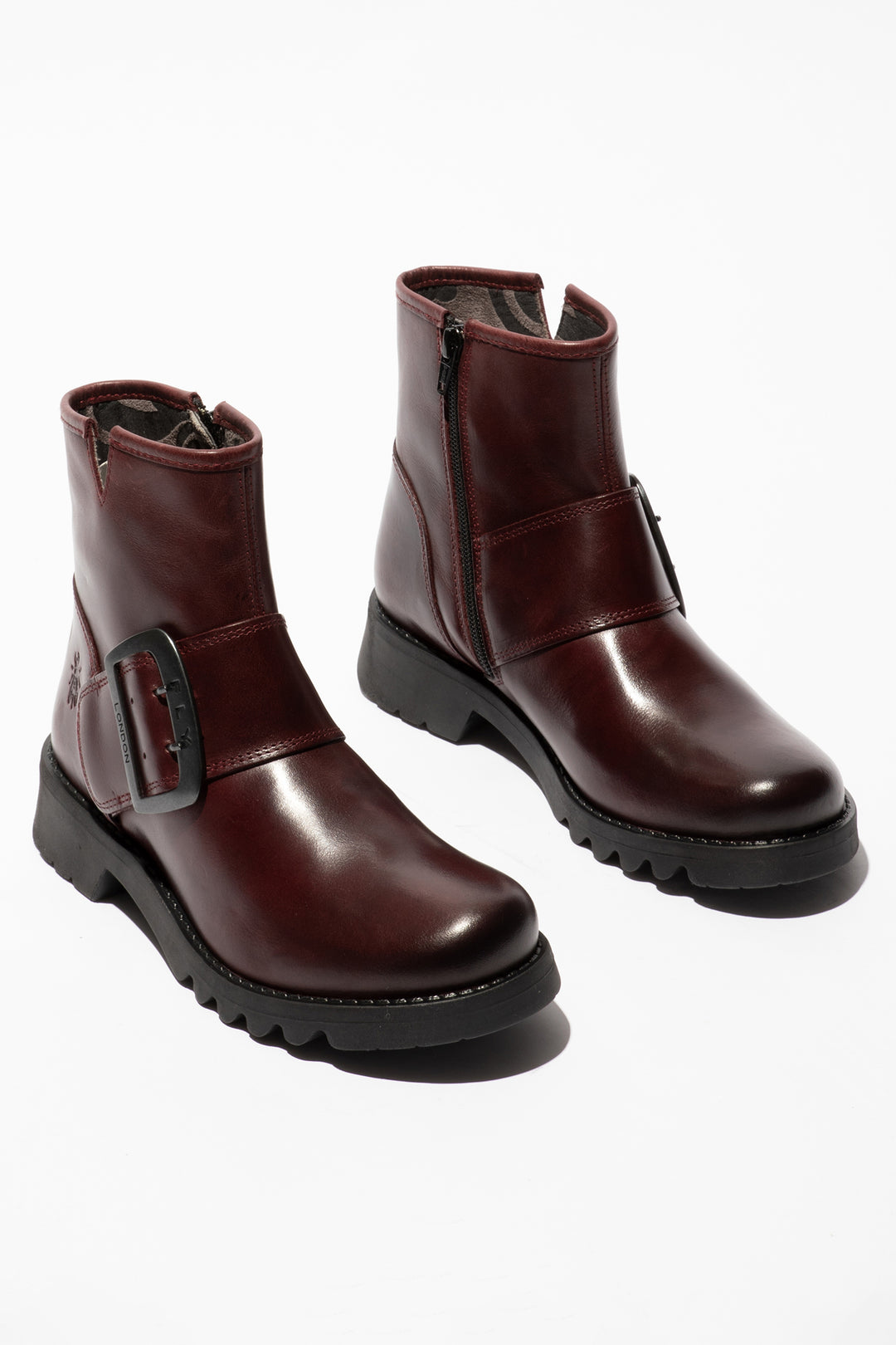 Pair of brown leather boots on a white background