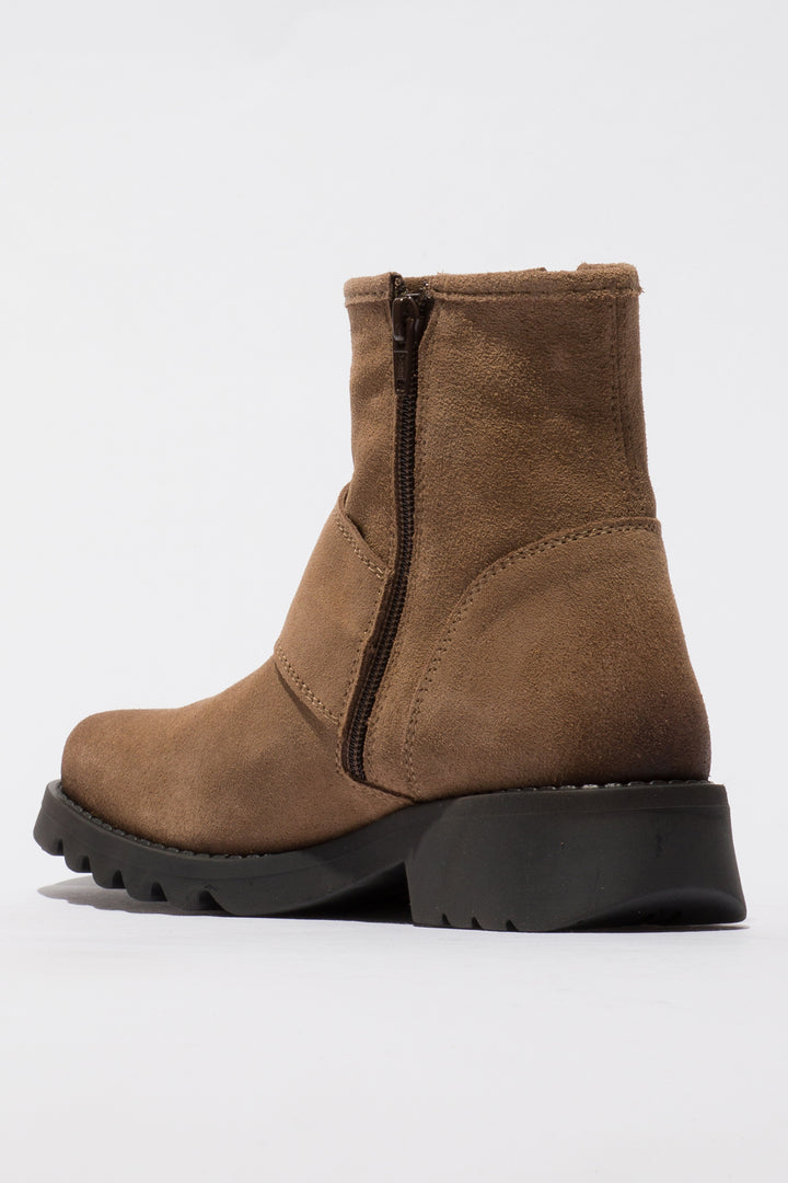Brown boot with a black sole on a white background
