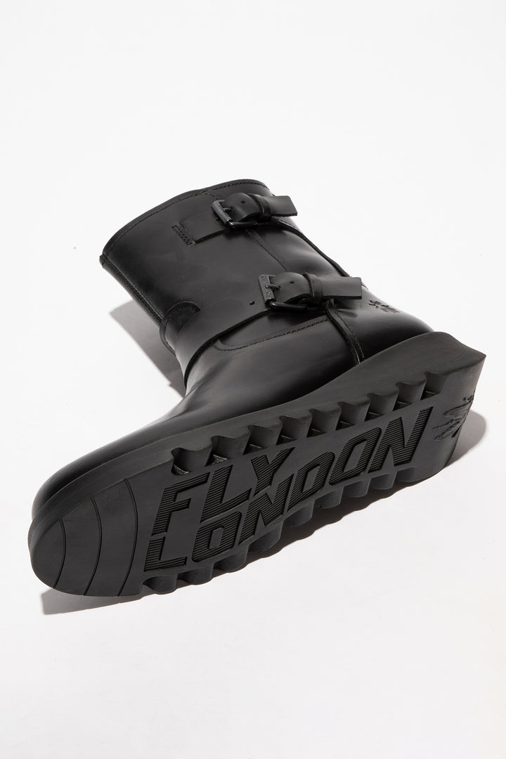 Black rubber boot with 'Fly London' branding on a white background