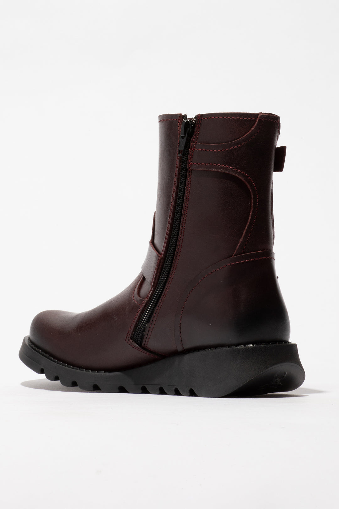 Brown ankle boot with a zipper on a white background