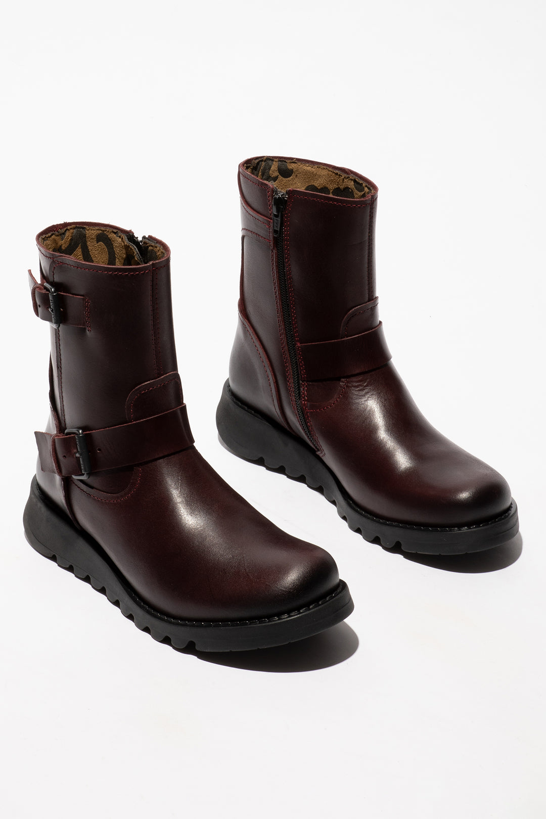Pair of brown leather boots on a white background