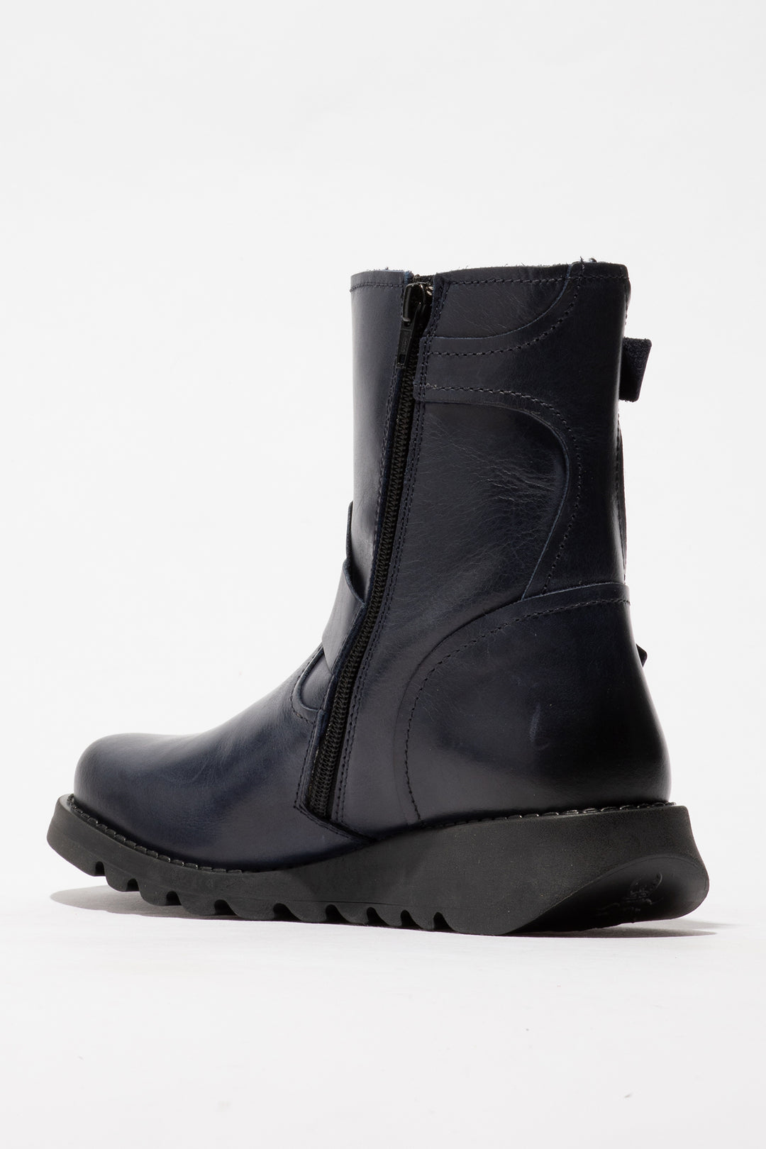 Navy boot with a zipper on a white background