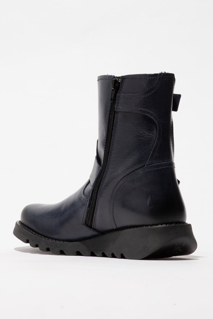 Navy boot with a zipper on a white background