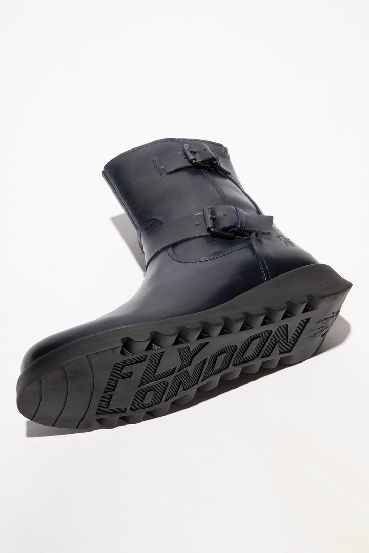 Navy rain boot with 'Fly London' branding on a white background