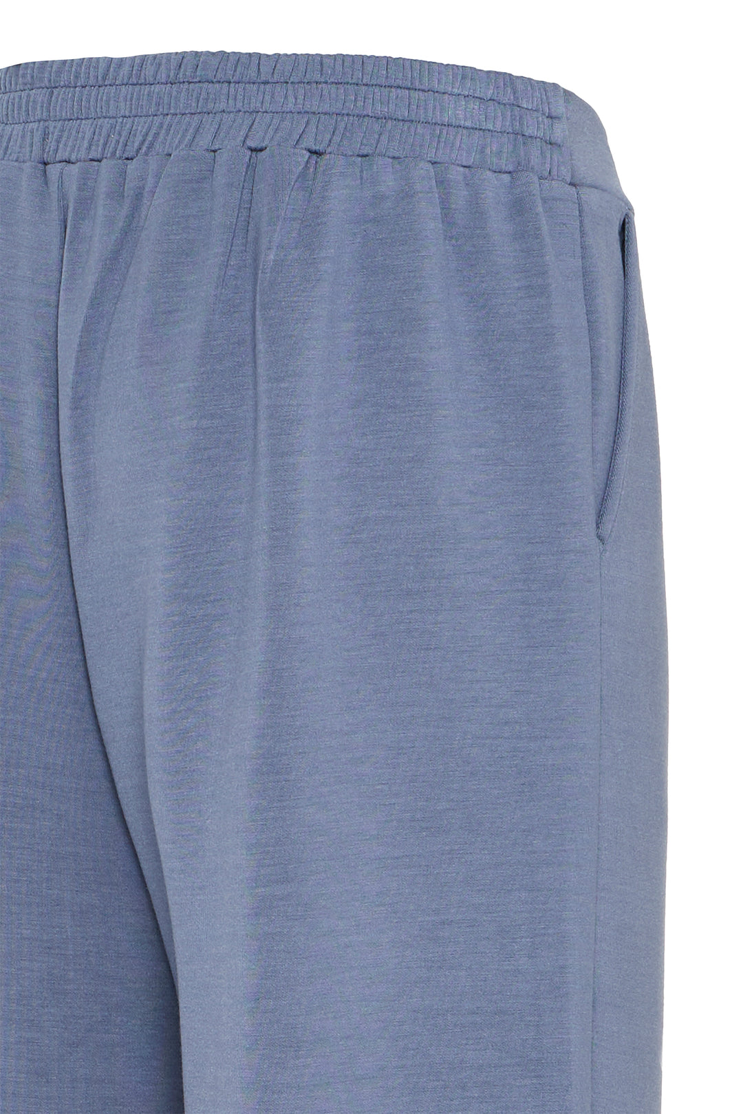 Close-up of blue pants on a white background
