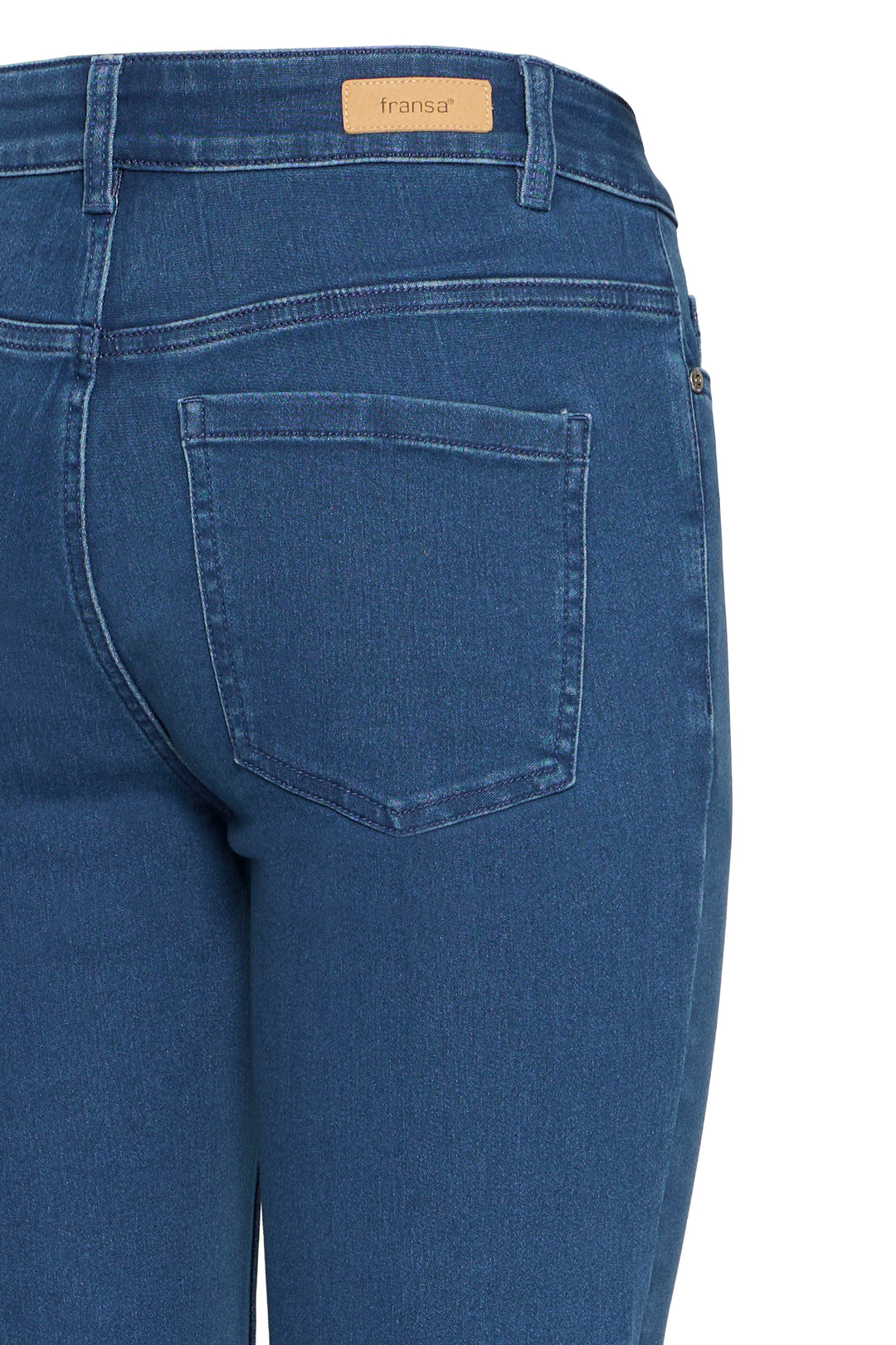 Blue jeans with a visible brand label on a white background
