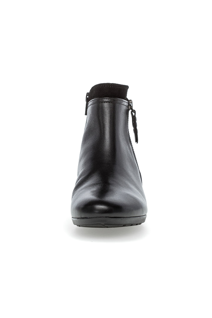 Black ankle boot on a white background
