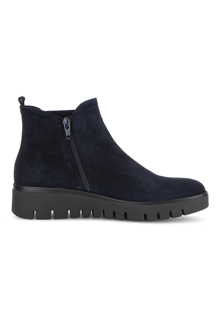 Navy blue ankle boot with a zipper on a white background