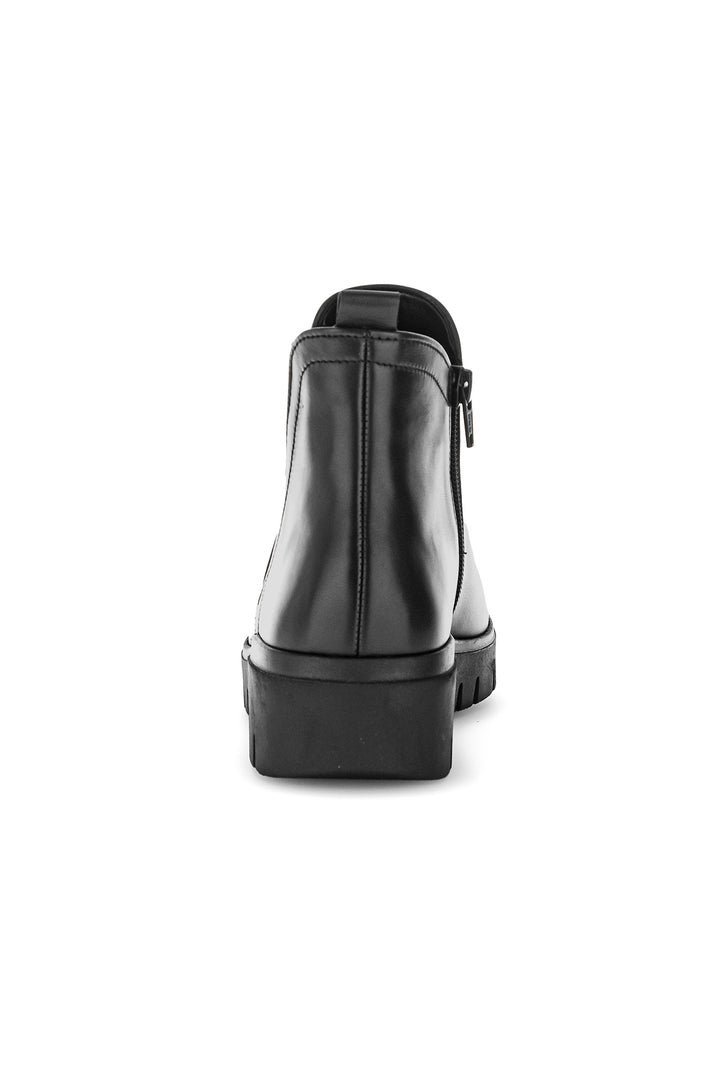 Black ankle boot on a white background