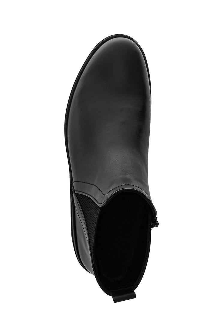 Black rubber boot on a white background