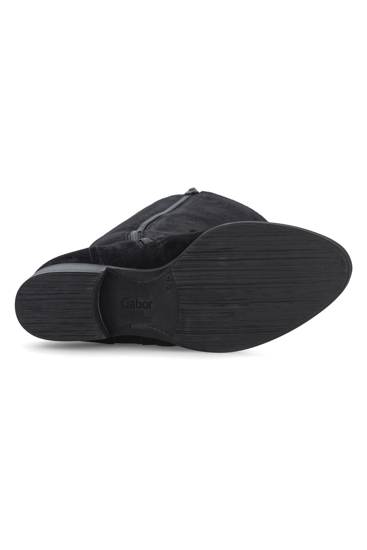Black slip-on shoe with a brand logo on a white background