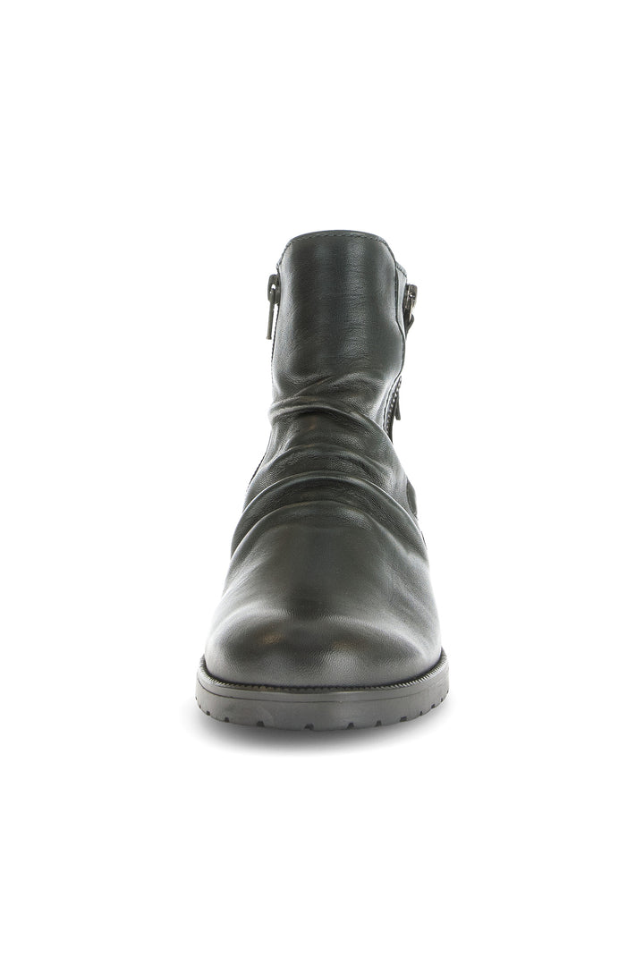 Black leather boot on a white background
