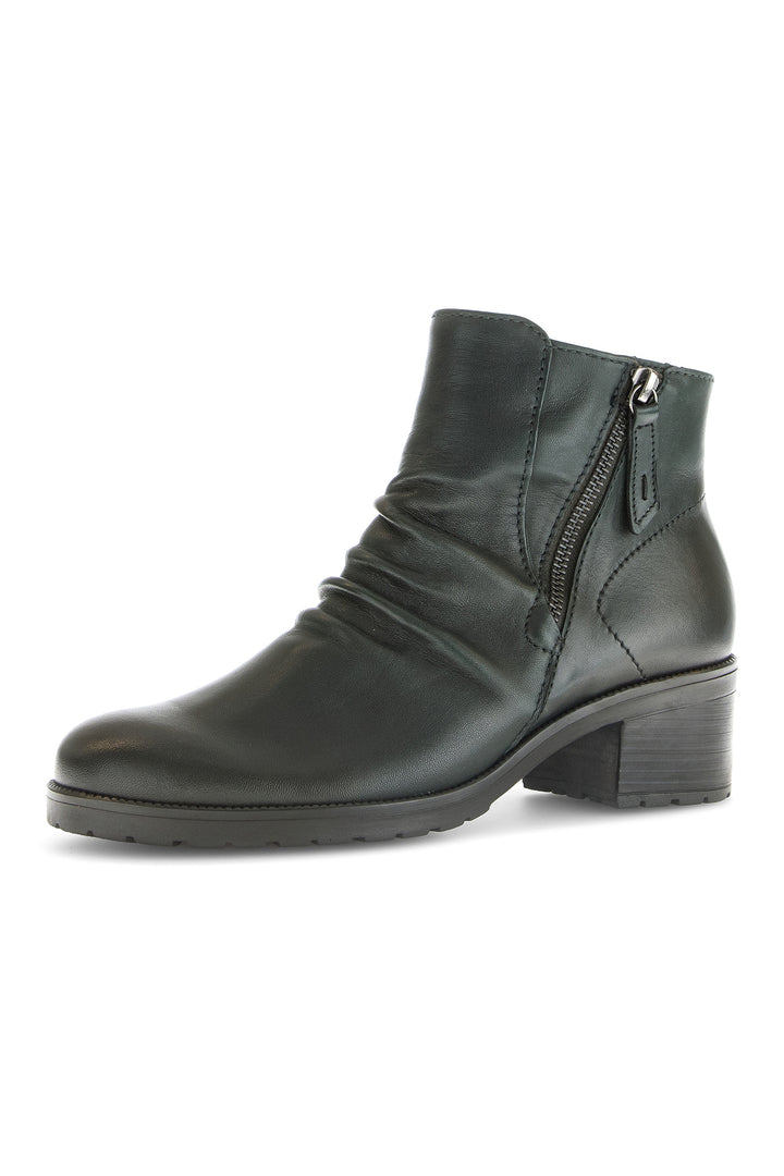Black leather ankle boot with a zipper on a white background