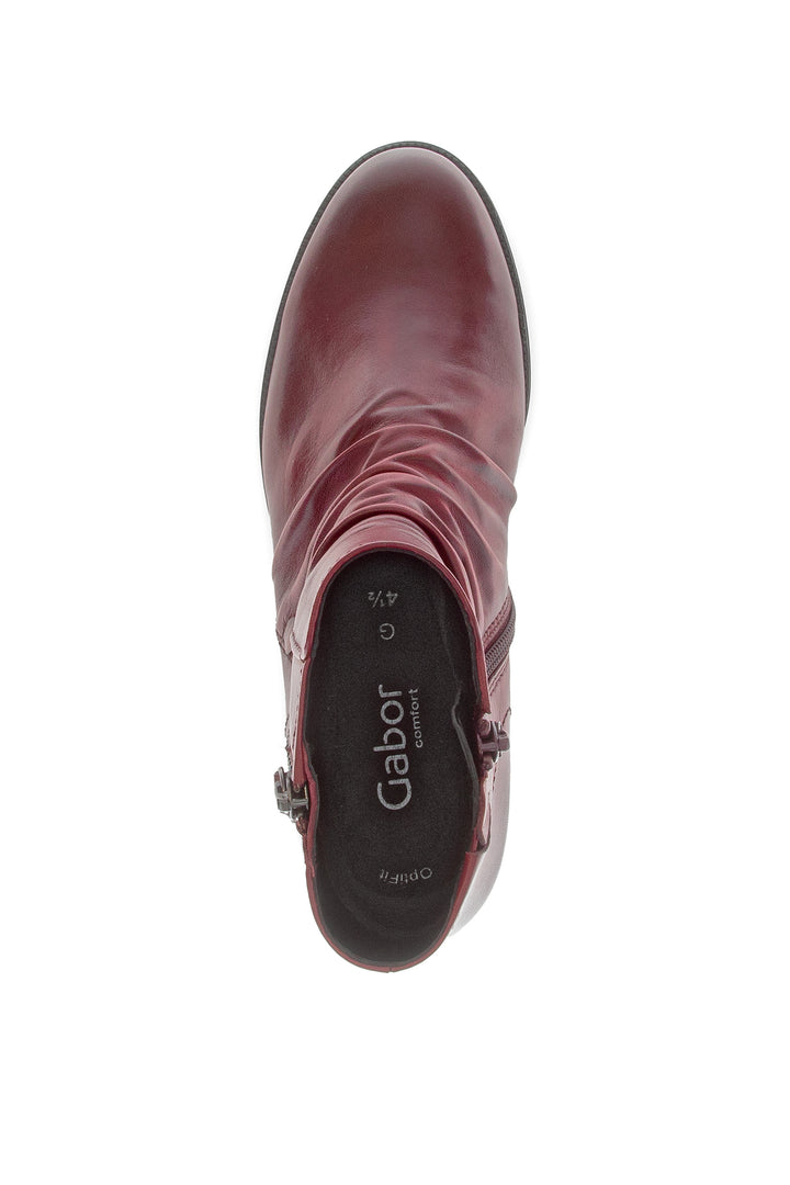 Maroon ankle boot with 'gabor' branding on a white background