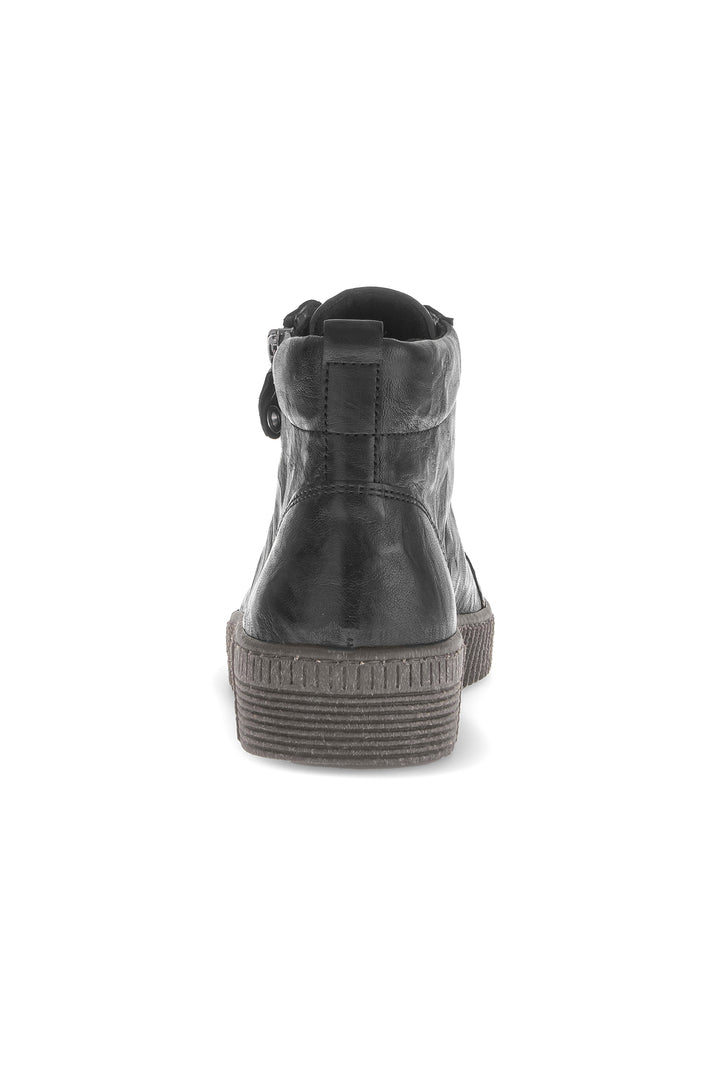 Black leather boot on a white background