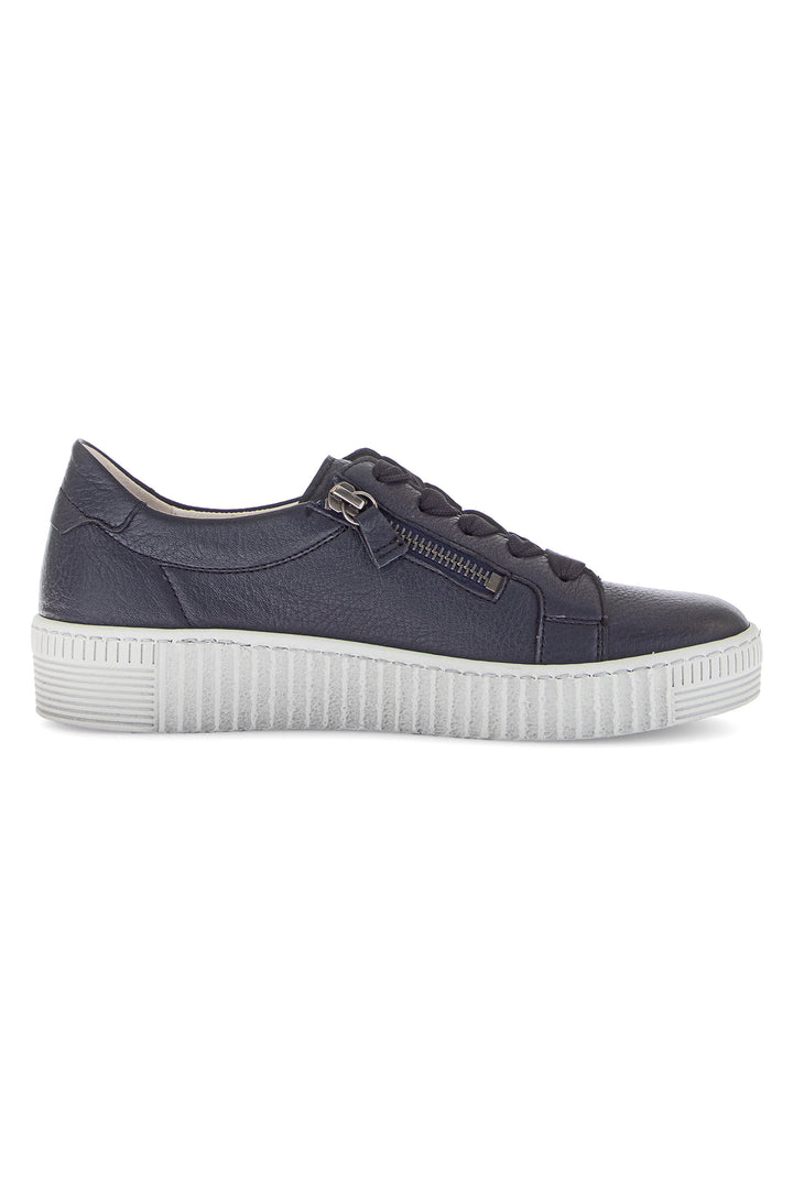 Navy blue sneaker with white sole on a white background