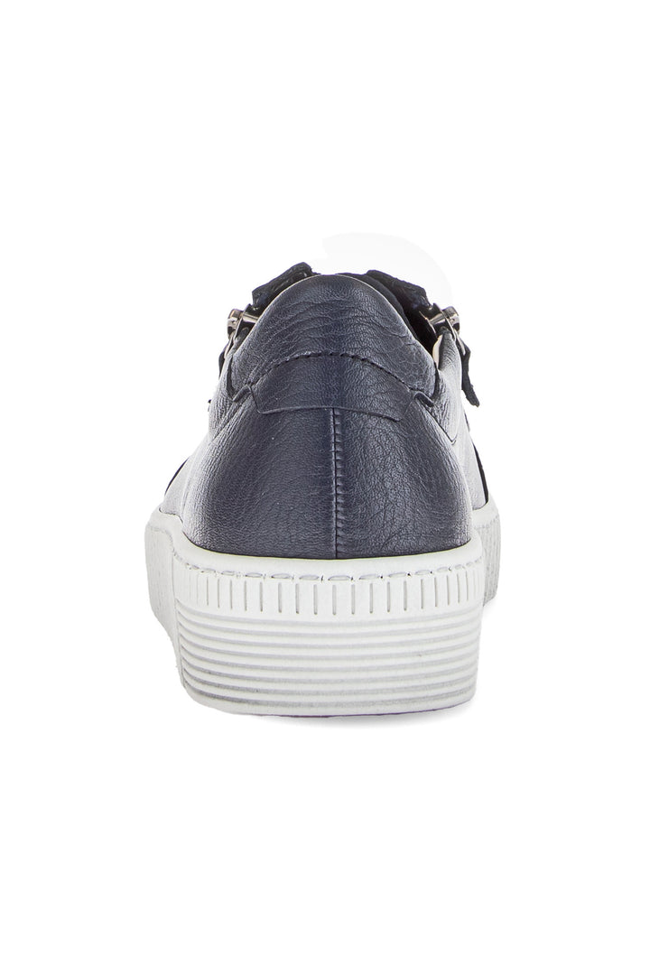 Navy blue sneaker with white sole on a white background