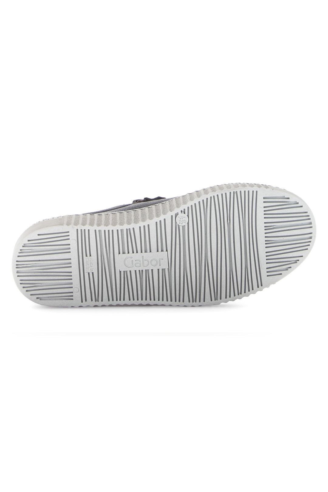 Close-up of a shoe sole with tread pattern on a white background