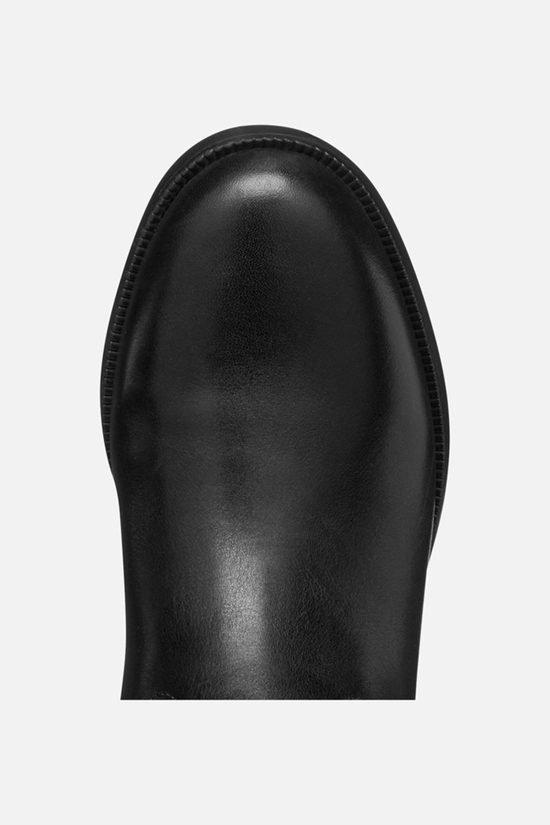 Black leather boot sole on a light gray background