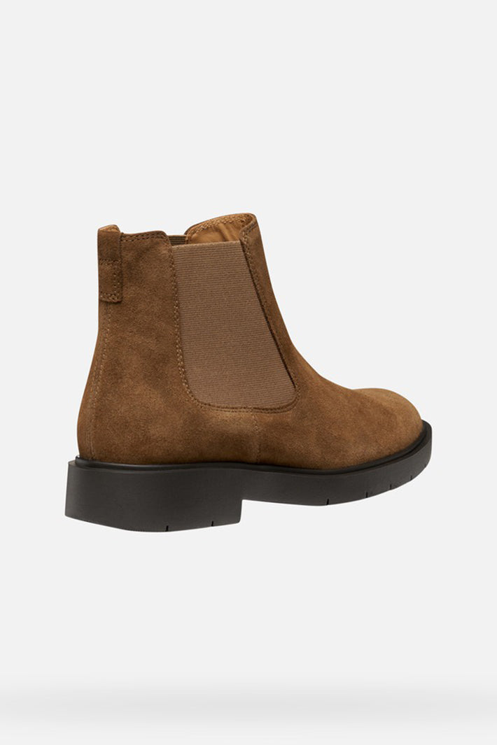 Brown suede ankle boot on a white background