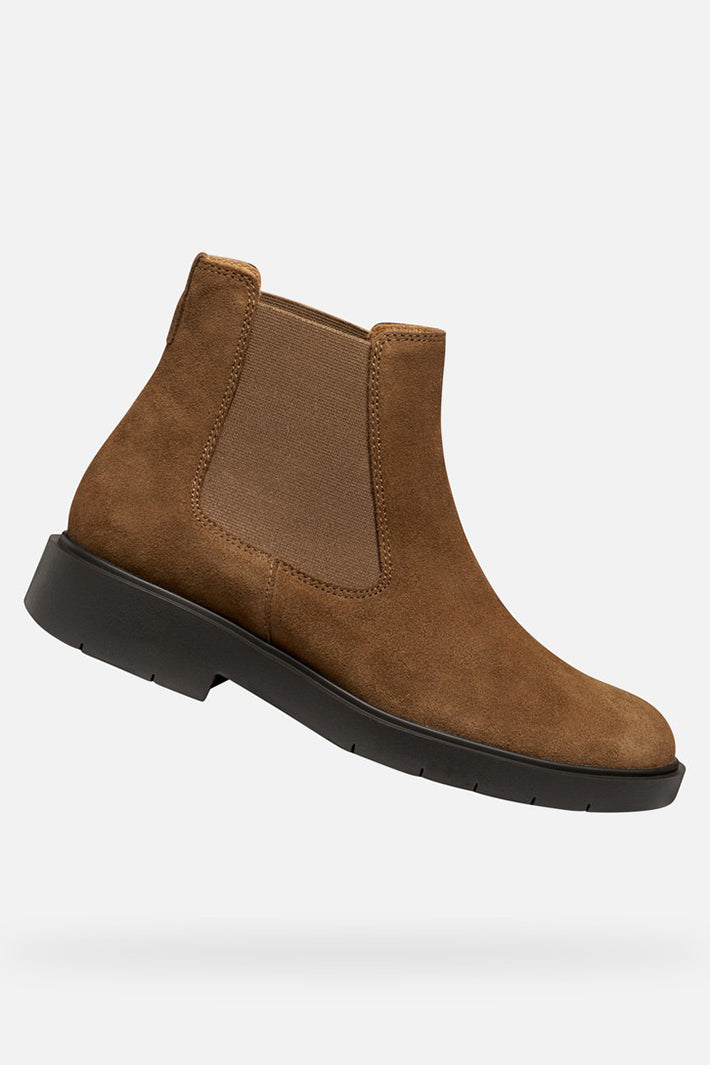 Brown suede Chelsea boot on a white background