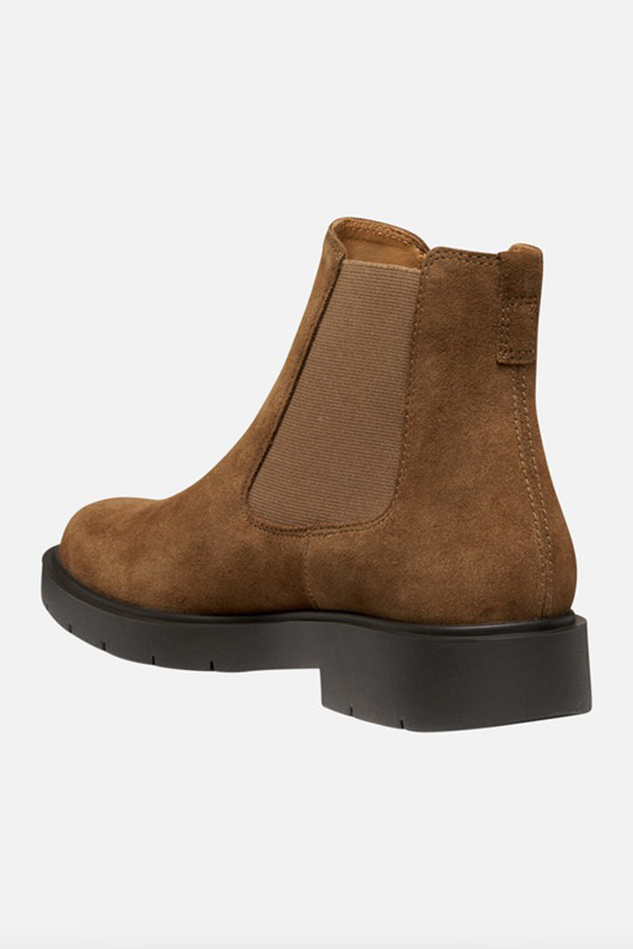 Brown suede Chelsea boot on a white background