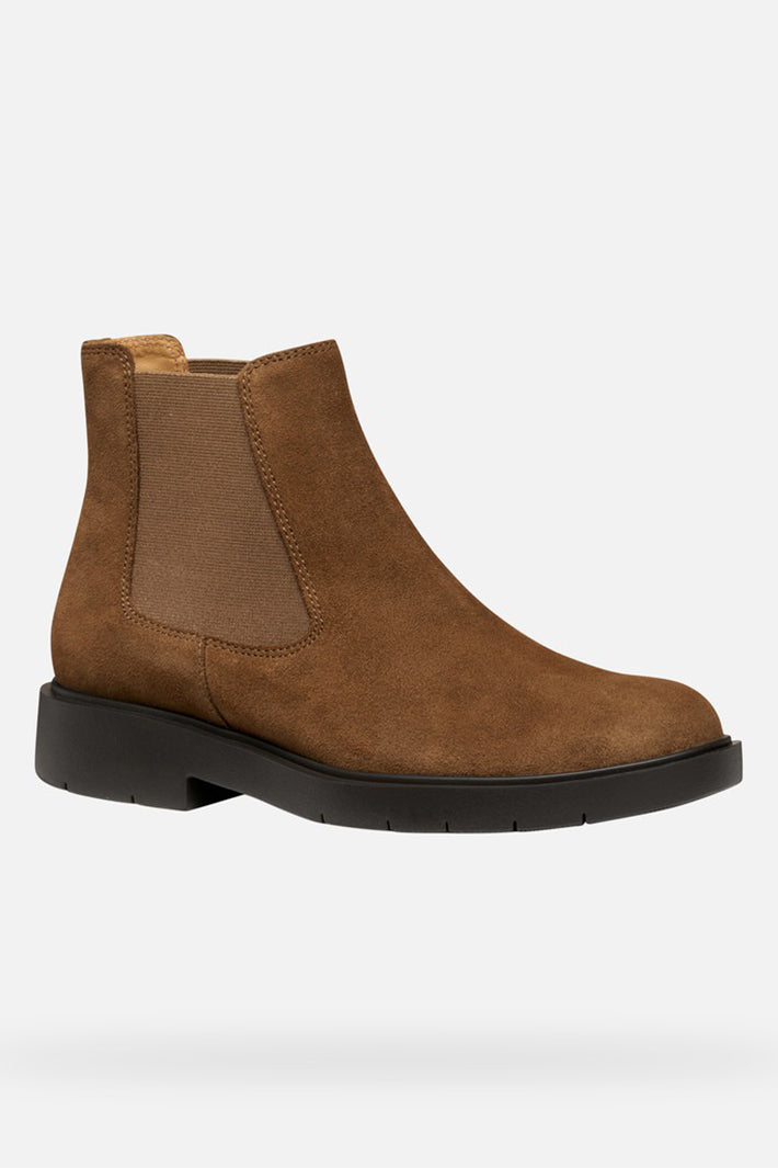 Brown suede Chelsea boot on a white background