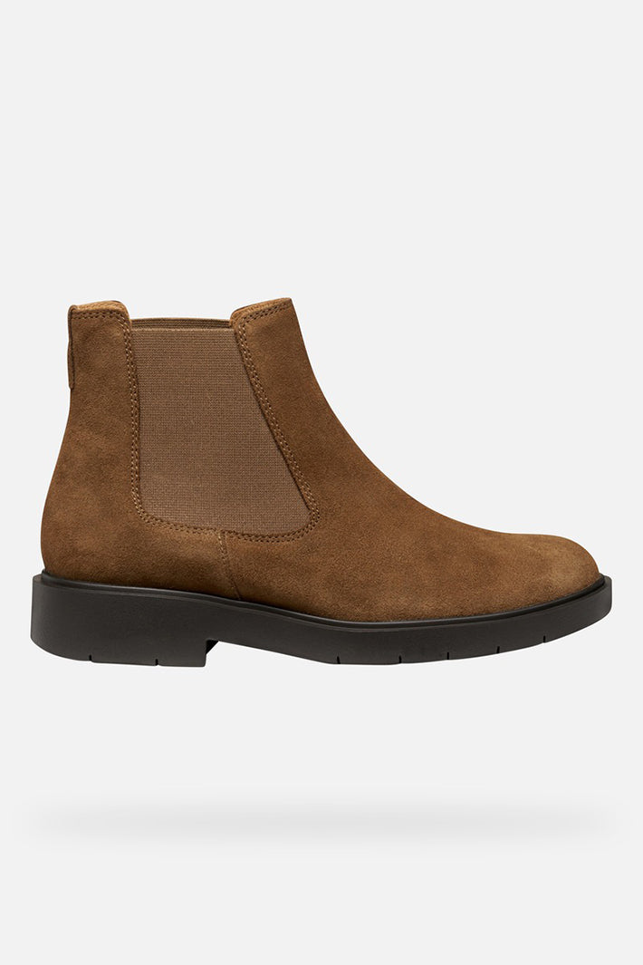 Brown suede Chelsea boot on a white background