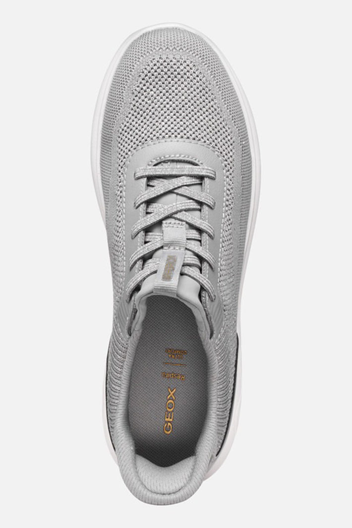 Gray sneaker with lace-up design on a white background