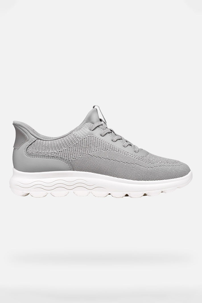 Gray sneaker with white sole on a white background