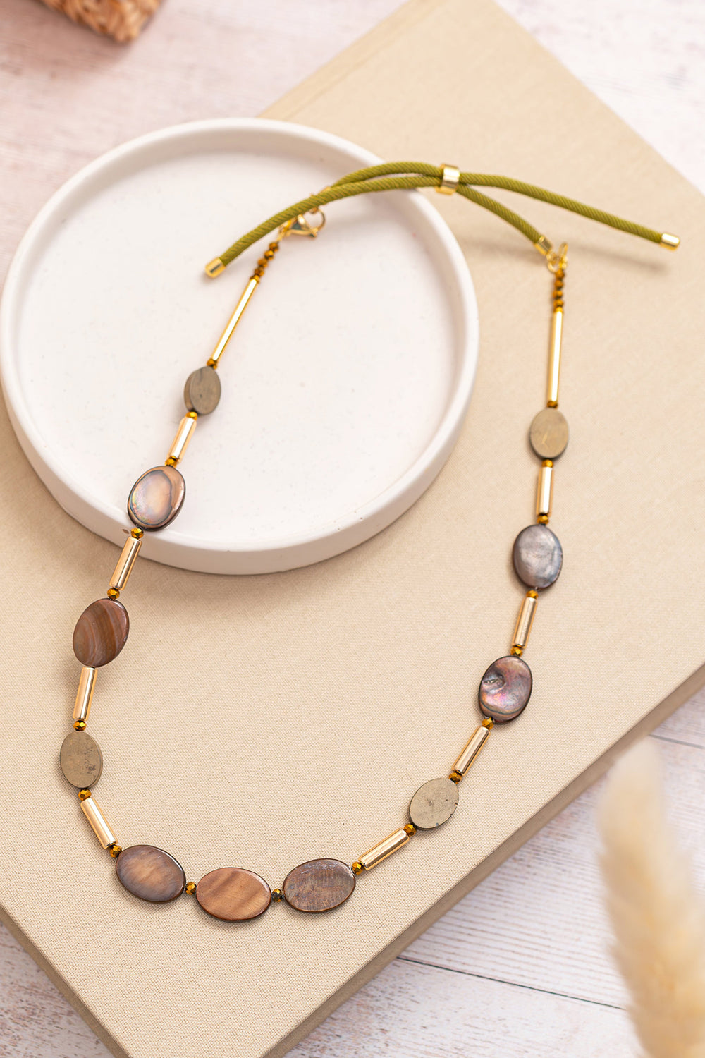 Gist Jewellery Brown Shell and Hematite Necklace BDL09, styled flat lay