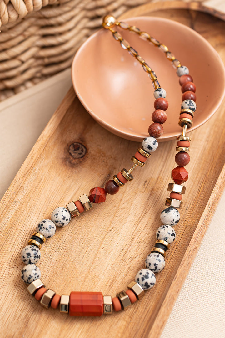 Gist Jewellery Red and Cream Dalmatian Jasper and Sandstone Barrel Necklace BDL02, styled flat lay