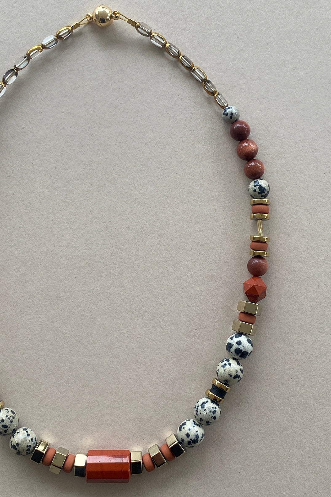 Gist Jewellery Red and Cream Dalmatian Jasper and Sandstone Barrel Necklace BDL02, laid flat, oval shape