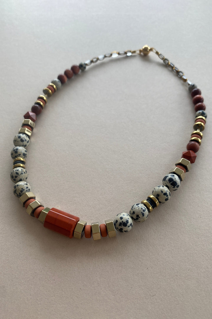 Gist Jewellery Red and Cream Dalmatian Jasper and Sandstone Barrel Necklace BDL02, laid flat, angled