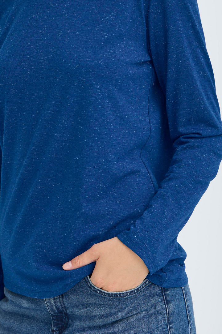 Person wearing a blue long-sleeve shirt on a white background