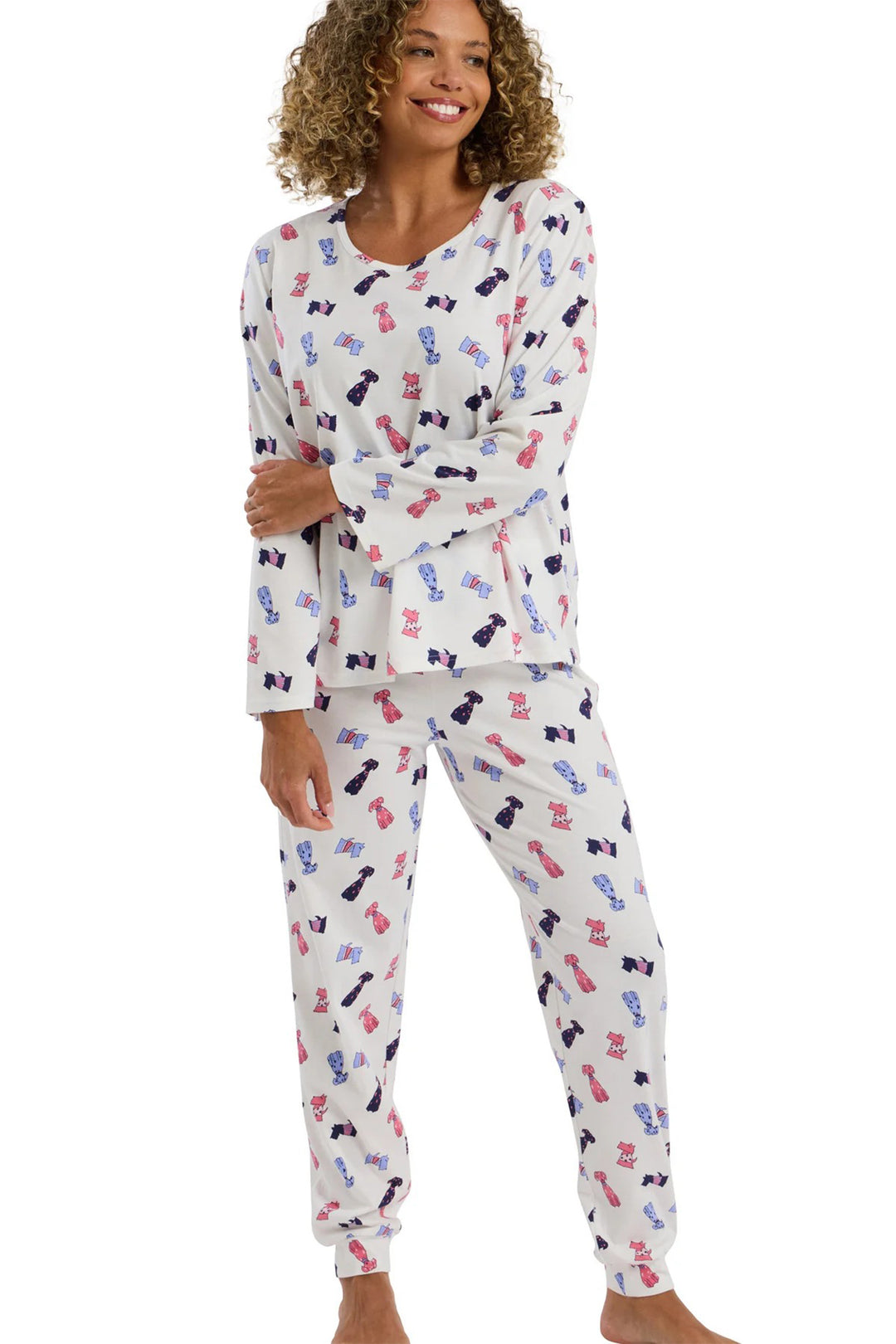 Woman wearing a patterned pajama set on a white background