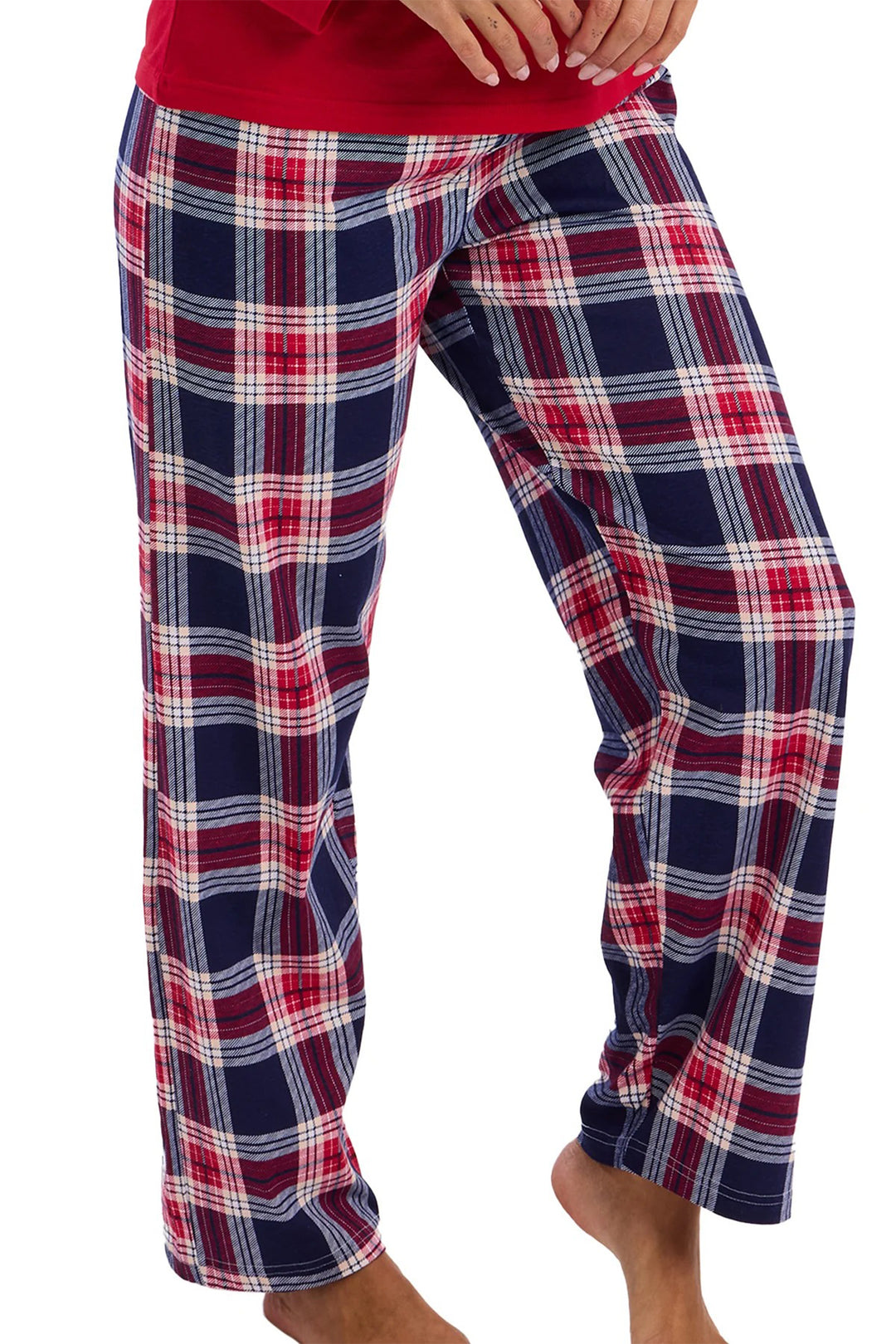 Plaid pajama pants worn by a person on a white background