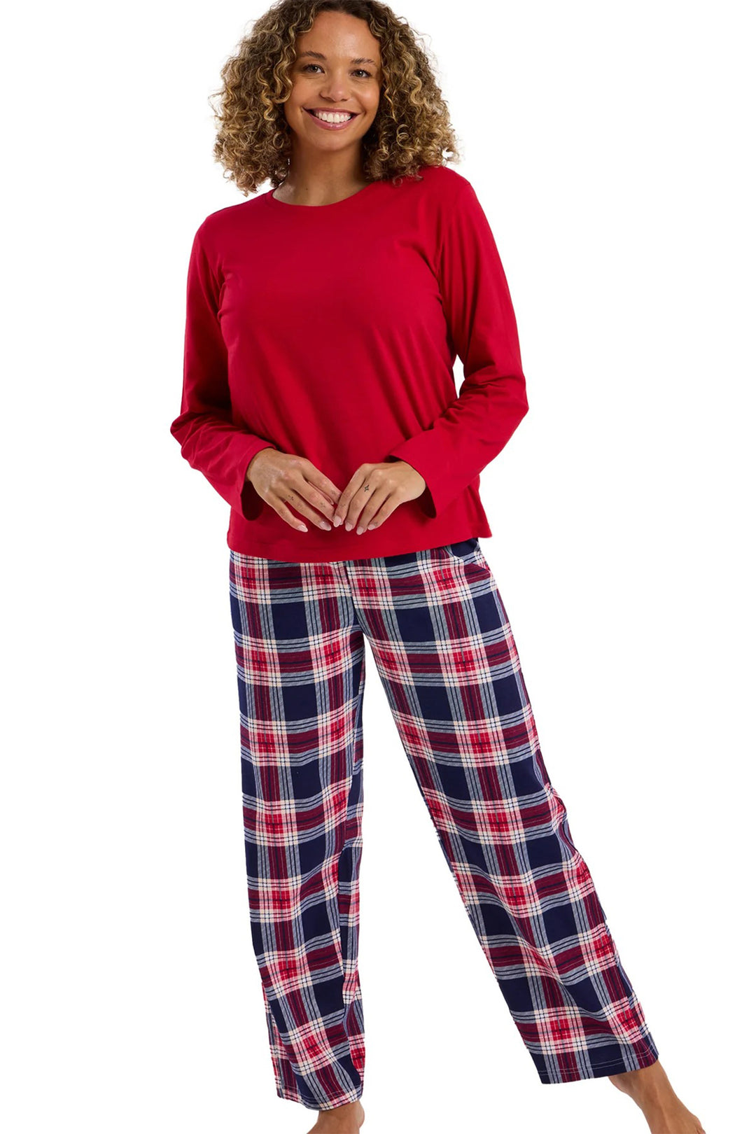 Woman wearing a red top and plaid pants on a white background
