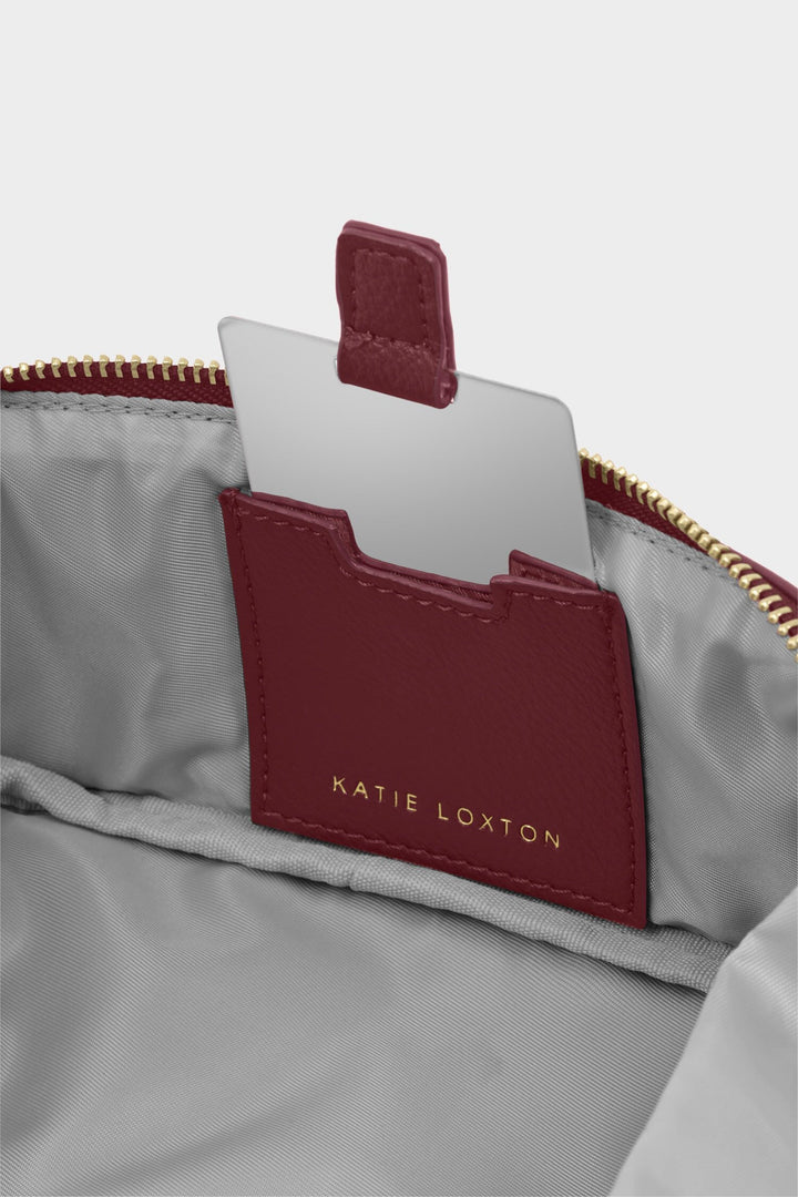 Katie Loxton cardholder inside a gray bag with a white background